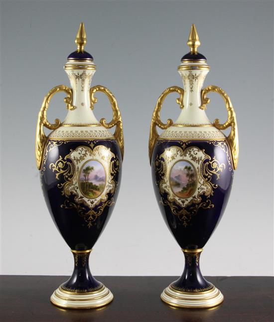 A pair of large Coalport oviform pedestal vases and covers, c.1902, 36cm